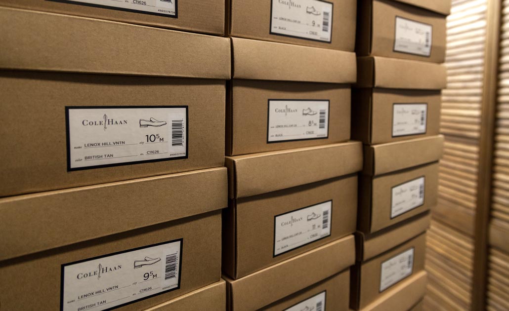 Cole Haan shoes stacked in our storeroom